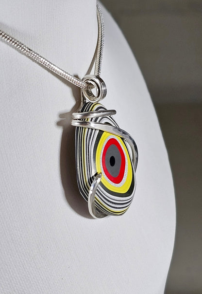 Fordite Handmade Stone Pendant Wrapped in Silver