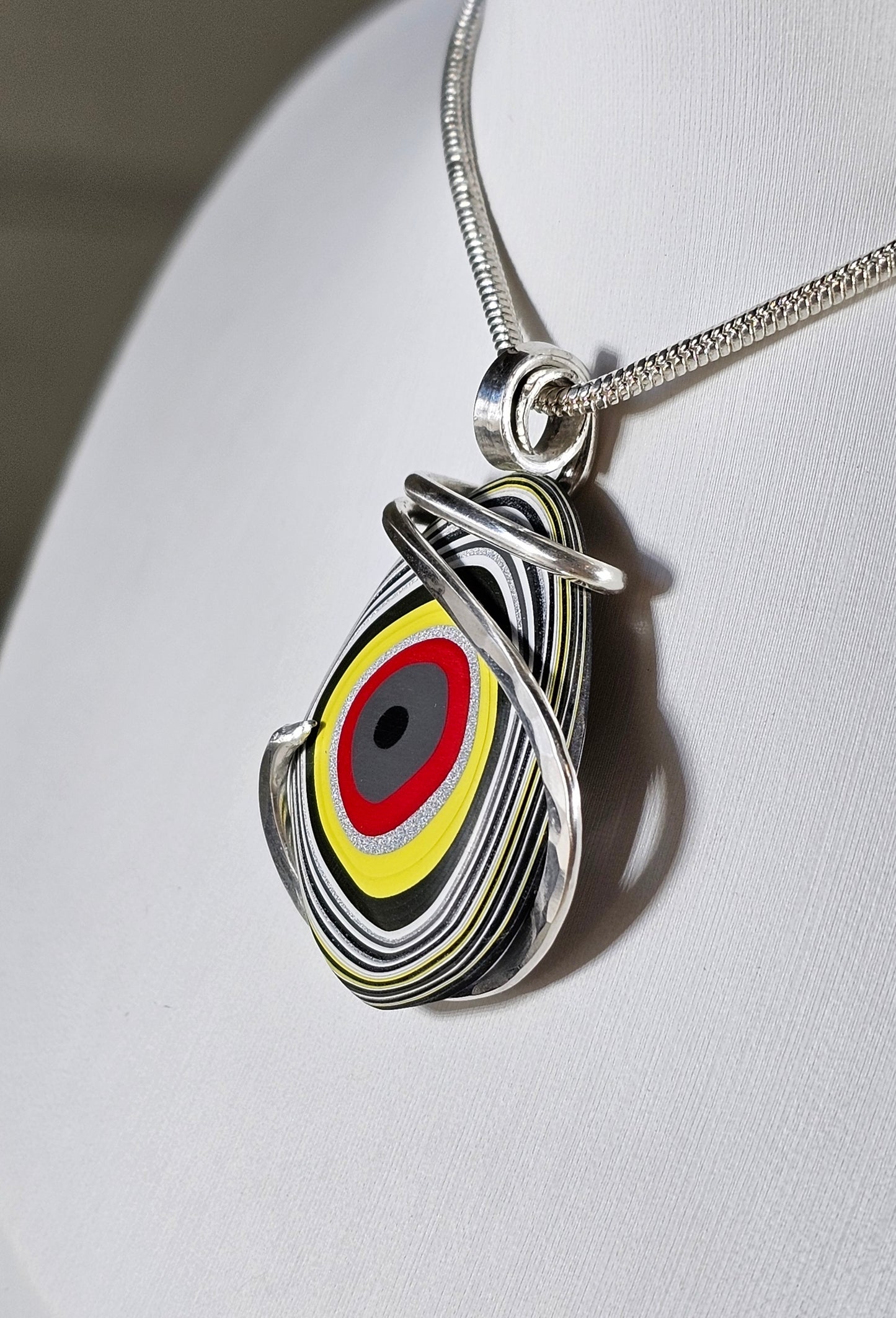 Fordite Handmade Stone Pendant Wrapped in Silver