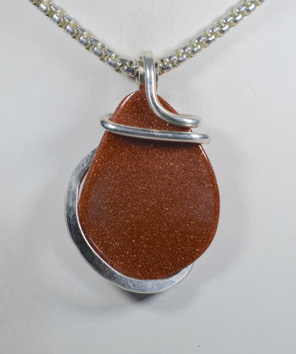 Goldstone Handmade Stone Pendant Wrapped in Silver