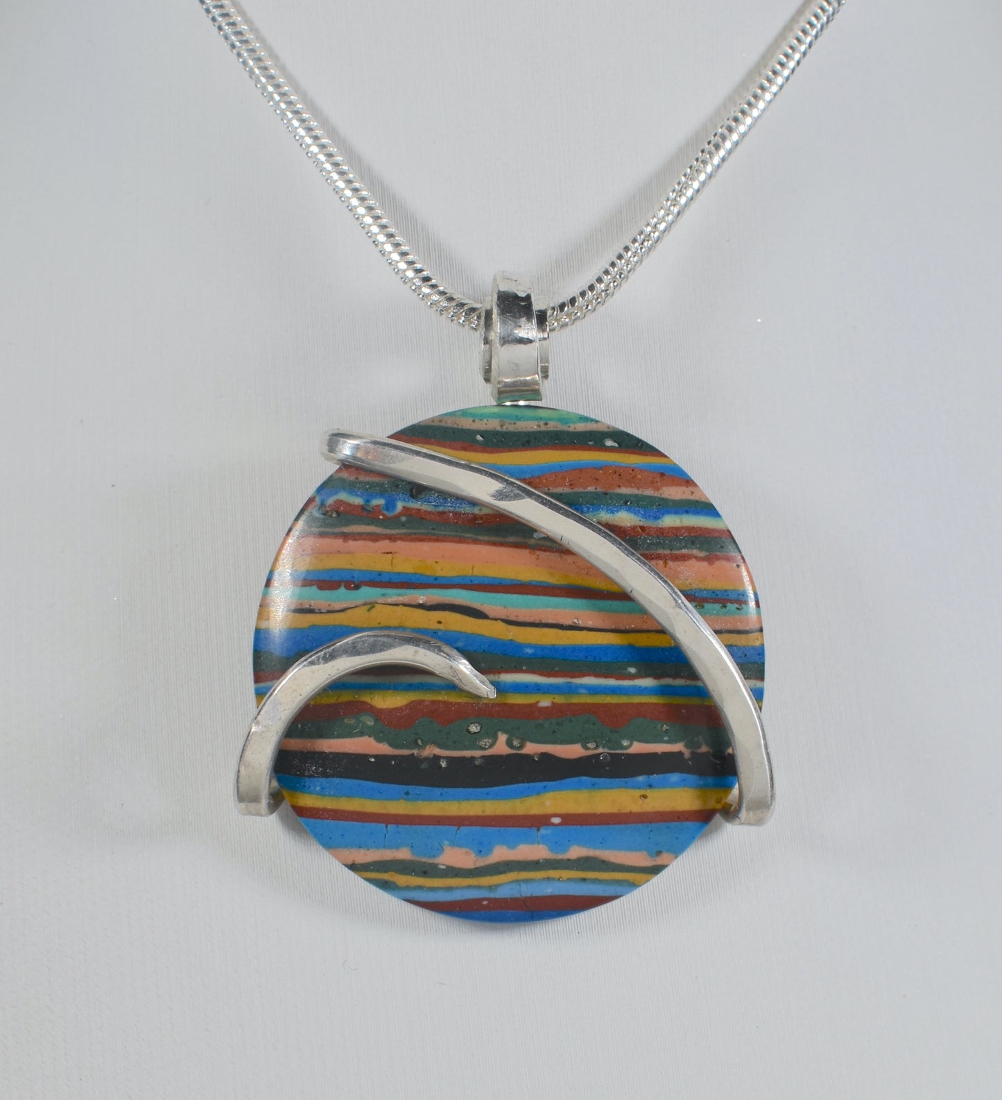 Fordite Handmade Stone Pendant Wrapped in Silver