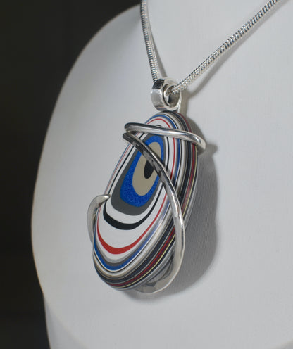 Fordite Handmade Stone Pendant Wrapped in Silver