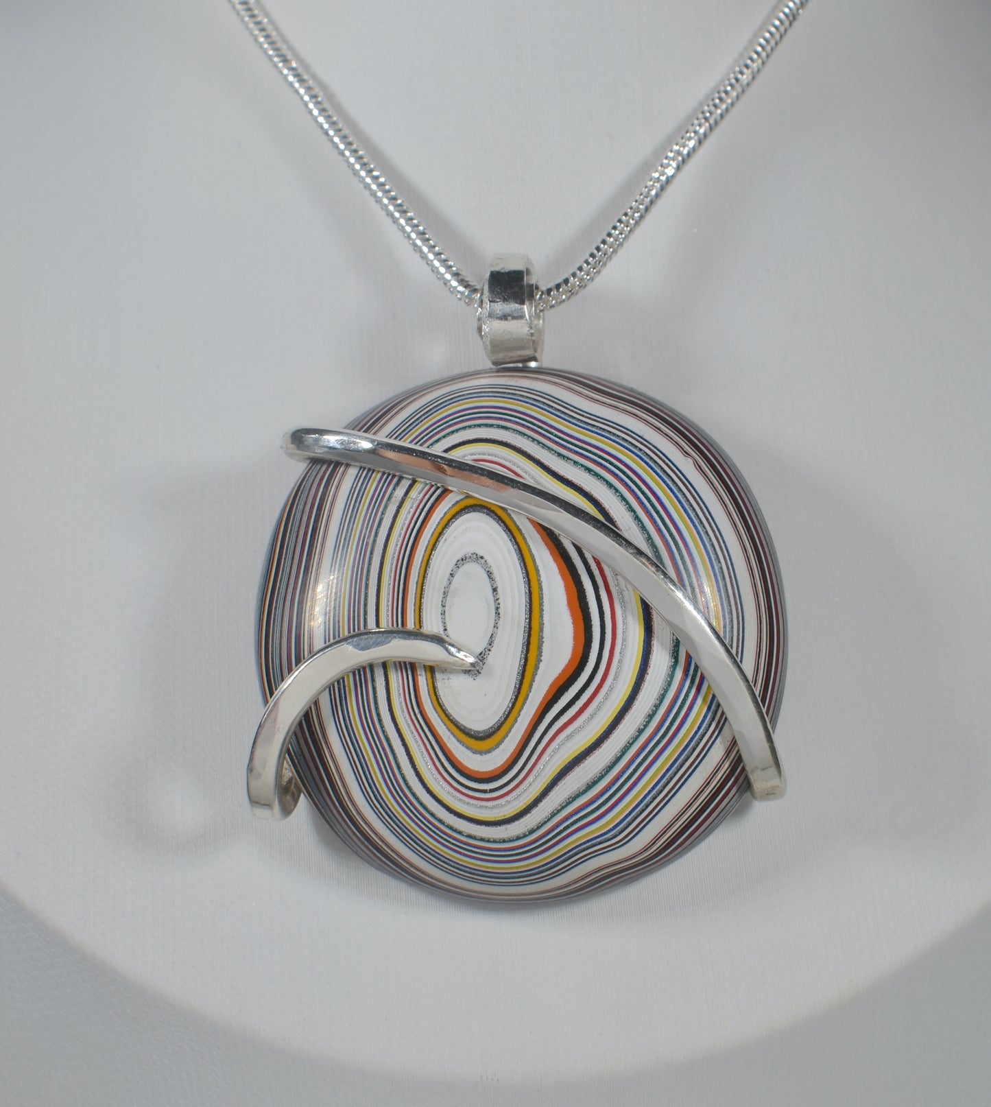 Fordite Handmade Stone Pendant Wrapped in Silver