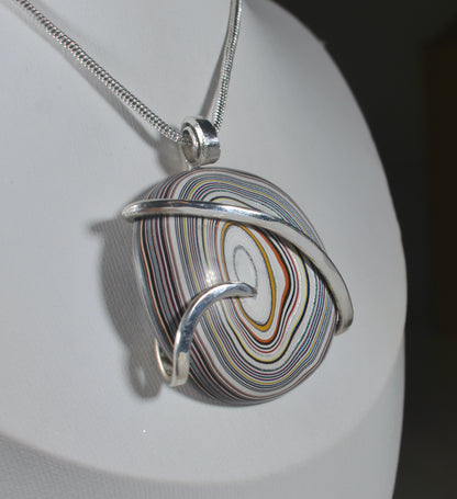 Fordite Handmade Stone Pendant Wrapped in Silver