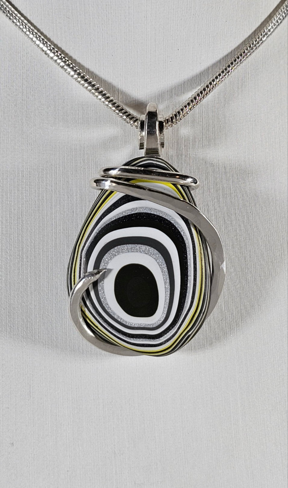 Fordite Handmade Stone Pendant Wrapped in Silver