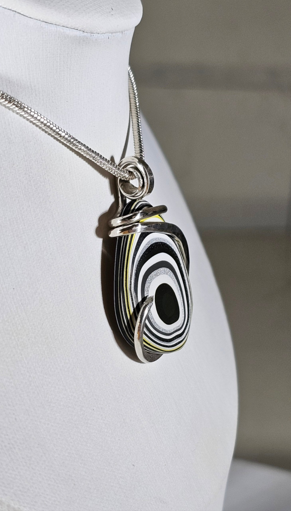 Fordite Handmade Stone Pendant Wrapped in Silver